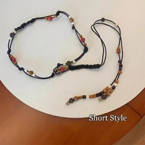 Bohemian multi-layer beaded waist chain with colorful beads on black woven cord