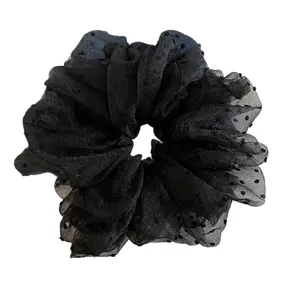 Elegant black polka dot mesh scrunchie made of sheer organza fabric for women