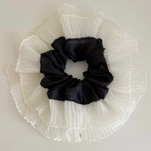 Ballet style oversized satin scrunchie with black and white pleated lace edge design