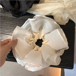 Oversized white organza scrunchie with layered ruffles for elegant French style hairstyles