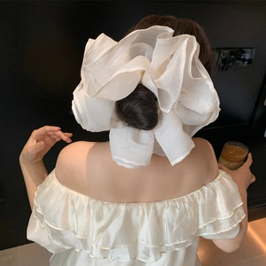 Oversized white organza hair scrunchie with layered pleats for elegant low bun styling