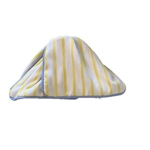 Minimalist yellow and white striped baby changing pad with light blue piping detail