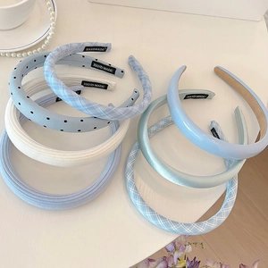 Blue and white polka dot and plaid headband set with handmade label on white desk
