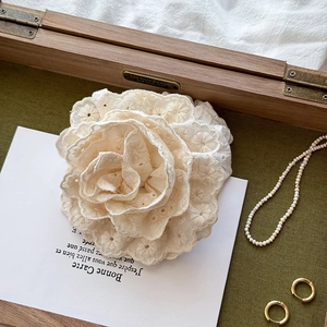 Elegant off-white embroidered rose scrunchie hair accessory with 3D petal floral design