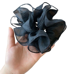 Elegant black double-layered pleated mesh scrunchie with fashion woven label for women