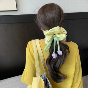 Yellow tulip scrunchie with purple fabric flowers for elegant ponytail hairstyles
