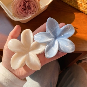 Elegant Frangipani acetate flower hair claws in cream and light blue marble finish