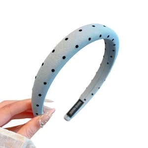 Light blue polka dot padded headband made of soft knit fabric with a handmade label