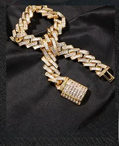 Detailed close-up of heavy gold-plated Cuban link chain with square cubic zirconia inlay