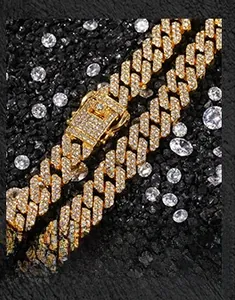 Detailed macro view of a 12mm gold-plated iced-out Cuban chain with sparkling white zircons
