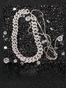 Detail of adjustable silver iced out Cuban chain necklace with sparkling slider clasp