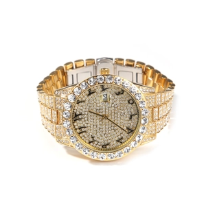Detailed view of gold crystal-encrusted watch with date window and Arabic numerals