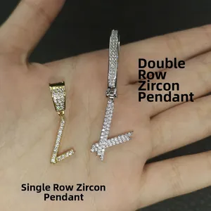Detail of cursive letter L pendants with single and double row zircon in hip hop style