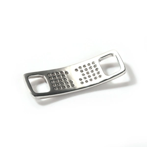 Polished silver shoe lace charm with shimmering zircon pavé and rectangular side holes