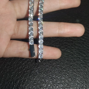 Detail of 4mm silver tennis necklace featuring round-cut crystals and a secure box clasp