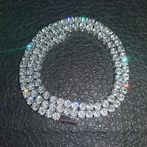 Detailed view of silver tennis necklace with round-cut zircons on black leather