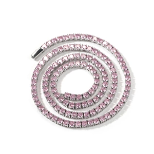 Detail of 4mm silver-tone tennis chain necklace with pink round-cut cubic zirconia stones