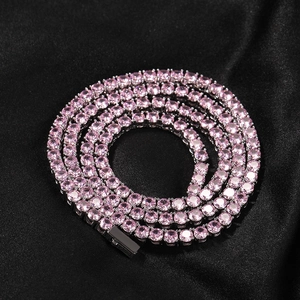Macro shot of 4mm pink tennis chain with round-cut stones on premium black silk