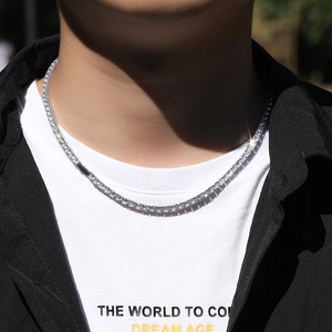Mens 4mm silver hip hop tennis necklace with sparkling cubic zirconia on white shirt