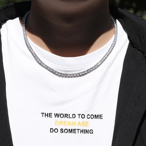 Detail of 4mm silver tennis chain with prong-set zircons worn for hip-hop street style