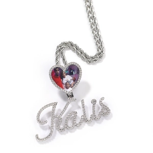 Macro shot of custom heart locket with family photo and iced-out Kalis letter pendant