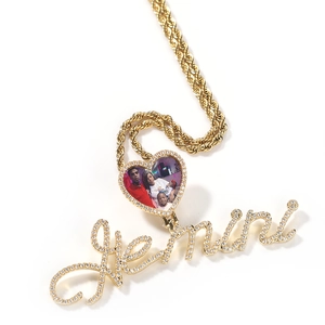 Macro detail of custom heart photo locket with Gemini nameplate and pave zircon stones