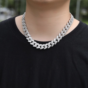 Hip hop style 15mm Cuban link chain in silver with cubic zirconia pave on male model