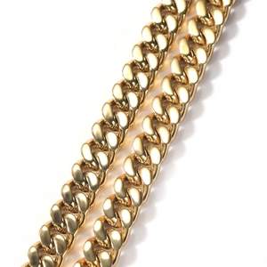 Macro view of highly polished 12mm gold cuban link chain with reflective mirror finish