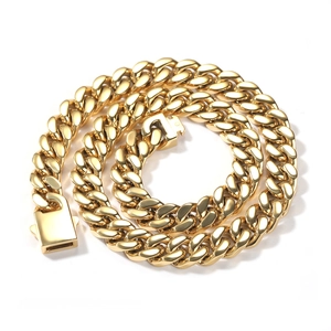 Close-up of a 12mm polished gold Cuban link chain with a heavy metallic luster