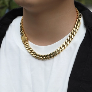 Detail of 12mm golden Cuban link necklace with rectangular smooth box clasp on male neck