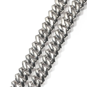 Macro detail of a 13mm silver Cuban link chain with a polished hip hop finish