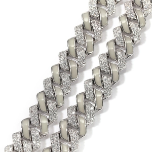 Macro shot of 13mm silver Cuban link chain with pave zircons and glow enamel inlay