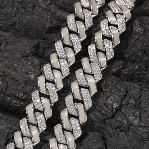 Macro view of 13mm silver hip hop Cuban chain with zircon and grey enamel detail