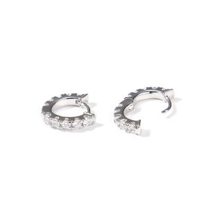 Detail view of silver zircon hoop earrings showing open and closed clasp design
