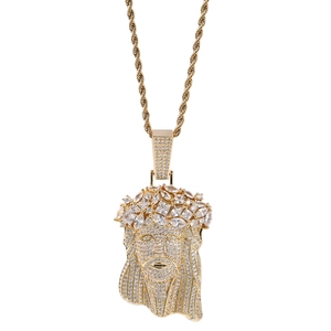 Detailed macro of gold plated Jesus portrait pendant with full zircon stones and rope chain