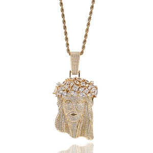 Detailed macro view of gold-plated hip hop Jesus pendant with micro-pave cubic zirconia