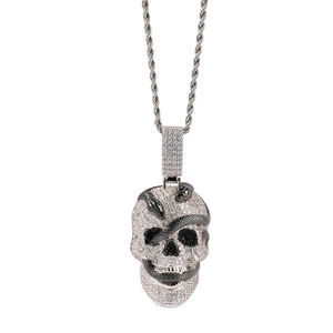 Close-up of hip hop skull snake pendant featuring white zircon pavé and twisted chain