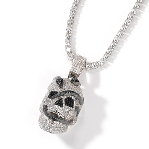 Macro shot of hip hop skull pendant with entwined snake and pavé cubic zirconia