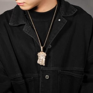 Detailed close-up of hip hop Jesus pendant with micro-pave cubic zirconia on rope chain