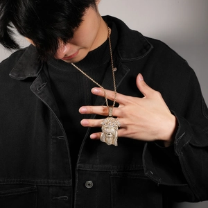 Close-up of hip hop Jesus head pendant with sparkling zircons and gold rope chain