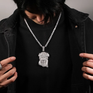 Close-up of iced out Jesus piece pendant with sparkling tennis chain for men
