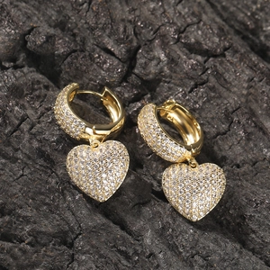 Hip hop style gold-plated heart drop earrings with iced out zircon pavé on black rock