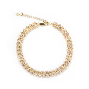 Close-up of golden Cuban link anklet featuring pave pink rhinestones and extender chain