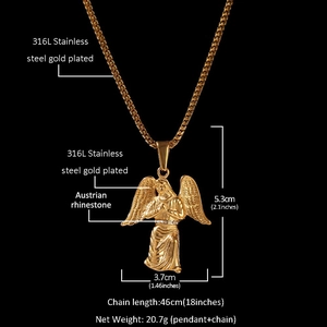 Macro detail of gold plated 316L stainless steel angel pendant with Austrian rhinestone