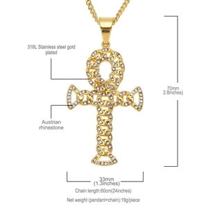 Macro detail of gold-plated Ankh cross necklace with crystal pavé and dimensions