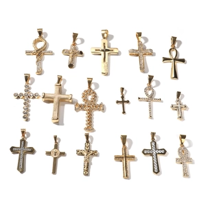 Collection of golden hip hop cross pendants with sparkling zircon inlays on white backdrop