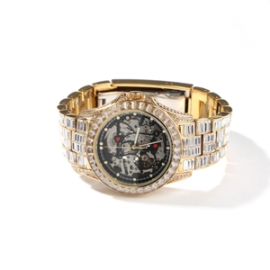 Luxury gold mechanical watch for men featuring a skeleton dial and baguette zircon inlay