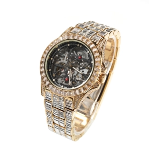 Macro detail of luxury gold skeleton watch showing intricate mechanical movement and diamonds