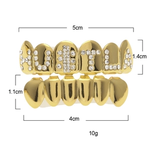 Detailed view of gold plated Hustle grillz set with sizing dimensions and white rhinestones