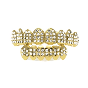 Macro shot of hip-hop gold plated fang grills with micro-pave white cubic zirconia stones